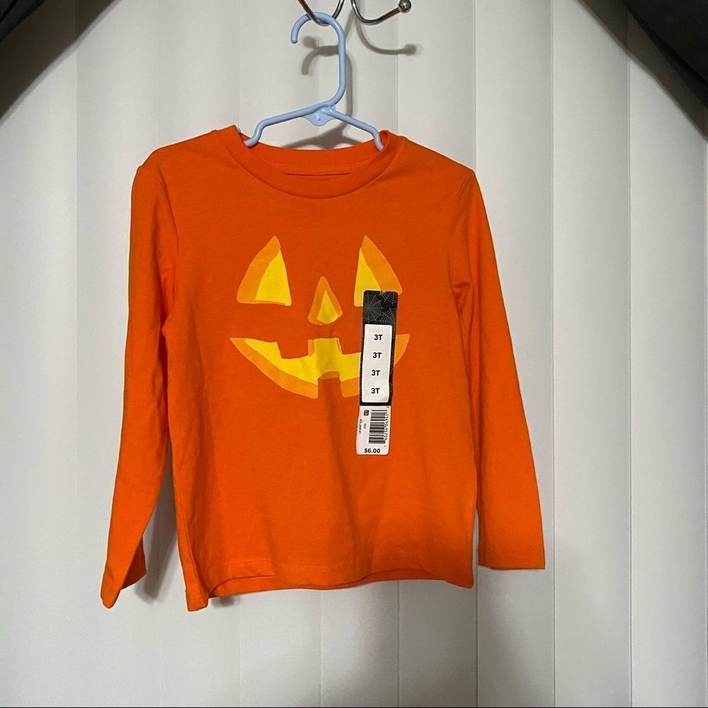 Halloween pumpkin face long sleeve toddler shirt, perfect for a quick costume